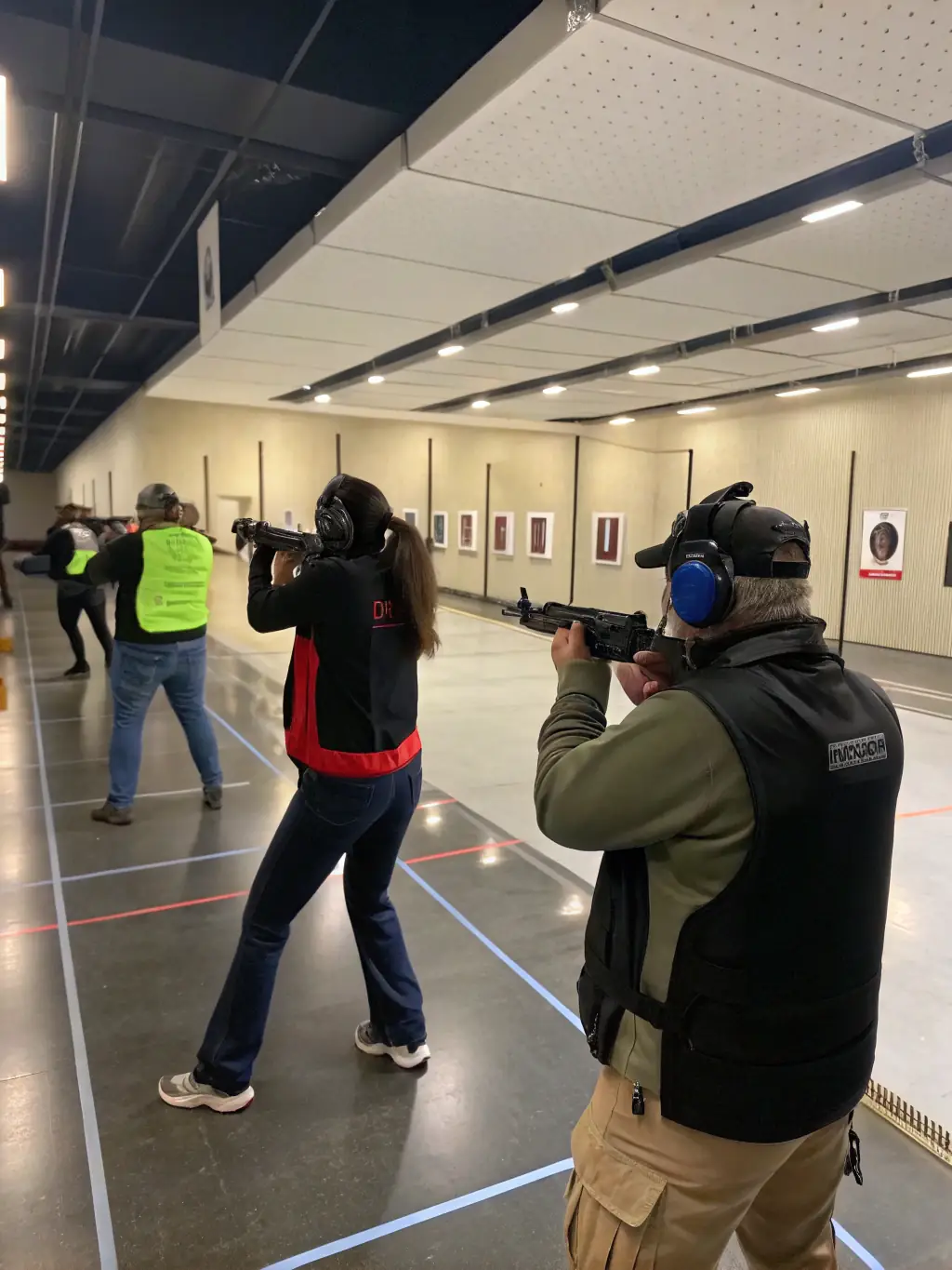 A group of participants receiving safety instructions from a certified instructor before a ball-trap event, emphasizing the importance of safety.